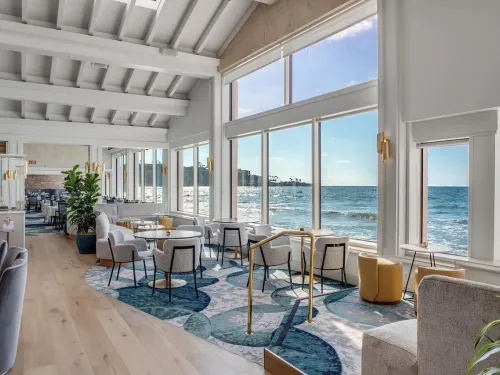 A view of the sea through the windows of the Marine Room restaurant in La Jolla on a bright San Diego day.