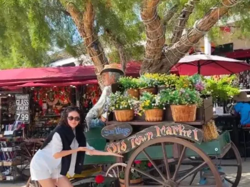 Gerry Isabelle in front of a cart at Old Town Historical Park in San Diego CA