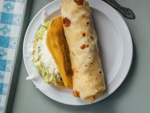 Burrito and taco on a plate near the 12th and Imperial trolley stop in San Diego, CA