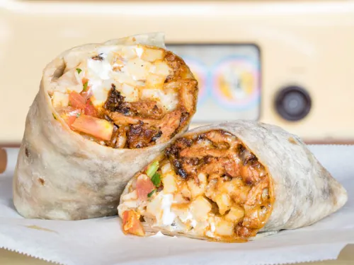 California Burrito cut in half with french fries, carne asada, and other items in San Diego, CA