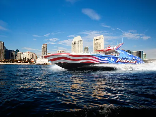  Red, white and blue Patriot Jet Boat making waves heading along San Diego Bay