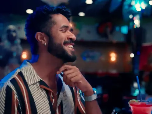 Close-up of Gabriel Feitosa smiling in the Gayborhood of Hillcrest, San Diego, CA