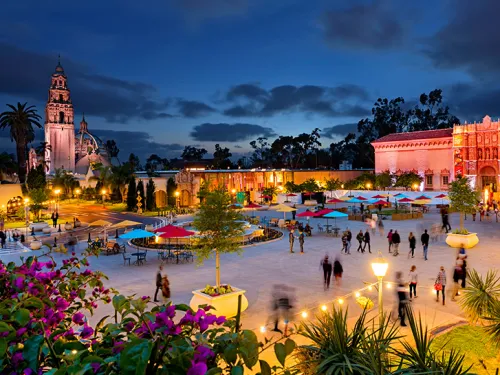 Balboa Park light up at dusk with museums and buildings
