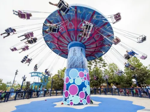 People flying on swings on a ride at SeaWorld San Diego