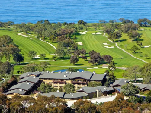 Aerial view of The Lodge at Torrey Pines with golf course and view of the ocean