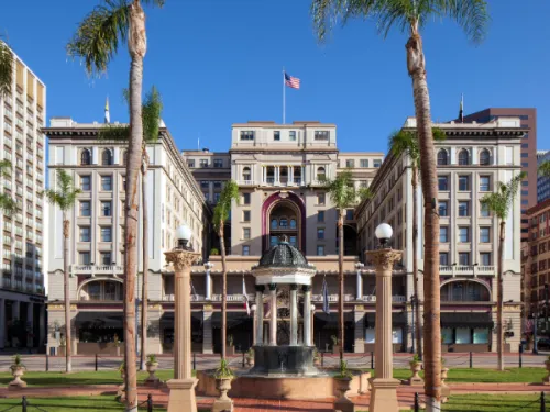 Palm trees lining entrance of the The US Grant in Downtown San Diego