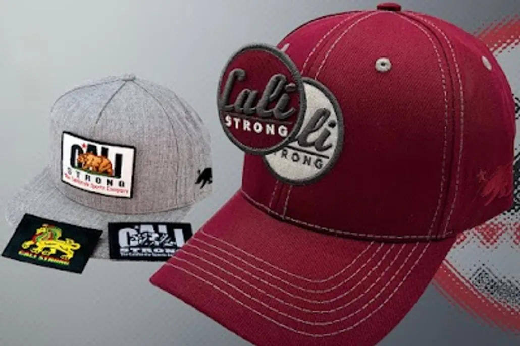 A gray "Cali Strong" flat-brim hat and a red "Cali Strong" curved-brim baseball cap are displayed side by side on a gray background.