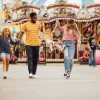 Family of four with two kids walking into Belmont Park